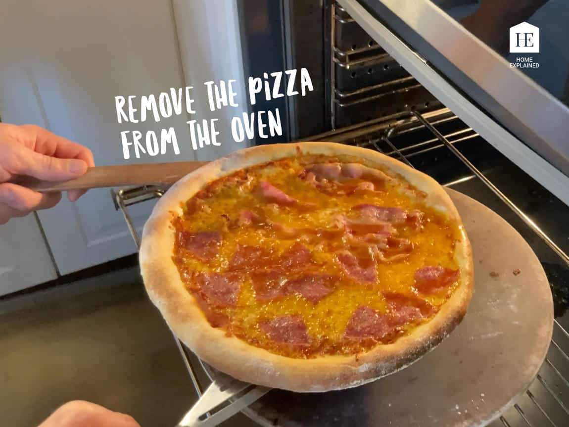 Removing the pizza from the oven