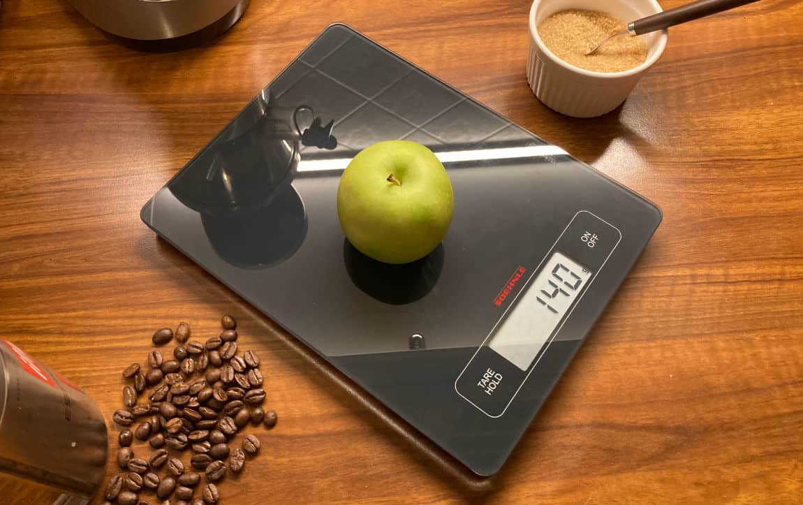 An apple on a kitchen scale